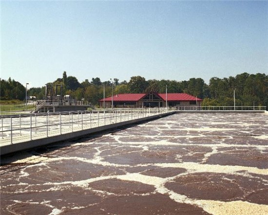 Photo of aeration basin and lab building at wastewater treatment plant